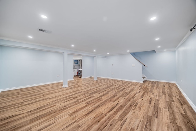 7013 W Greenleaf St, Niles, IL 60714 - finished basement with light wood-type flooring, recessed lighting, stairs, and ornamental molding