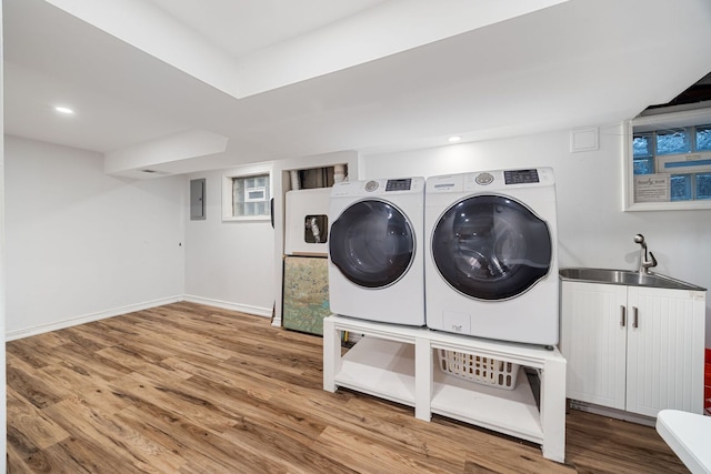 7013 W Greenleaf St, Niles, IL 60714 - laundry room with separate washer and dryer, wood finished floors, cabinet space, recessed lighting, and electric panel