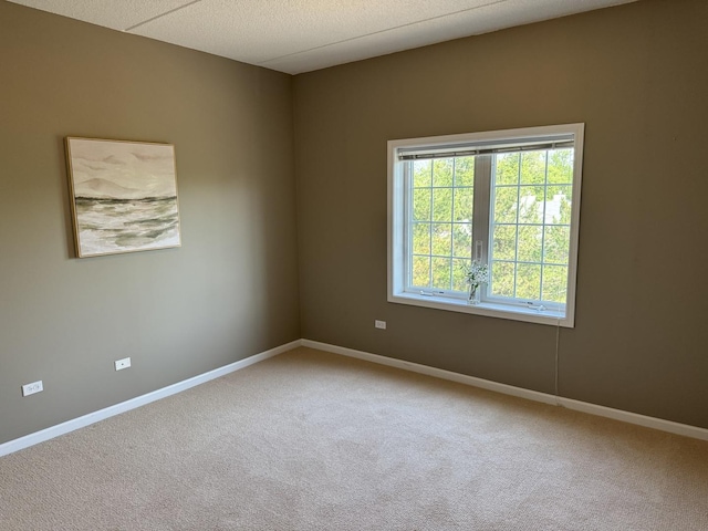 1479 N Milwaukee Ave Unit 312, Libertyville, IL 60048 - unfurnished room featuring carpet floors and baseboards
