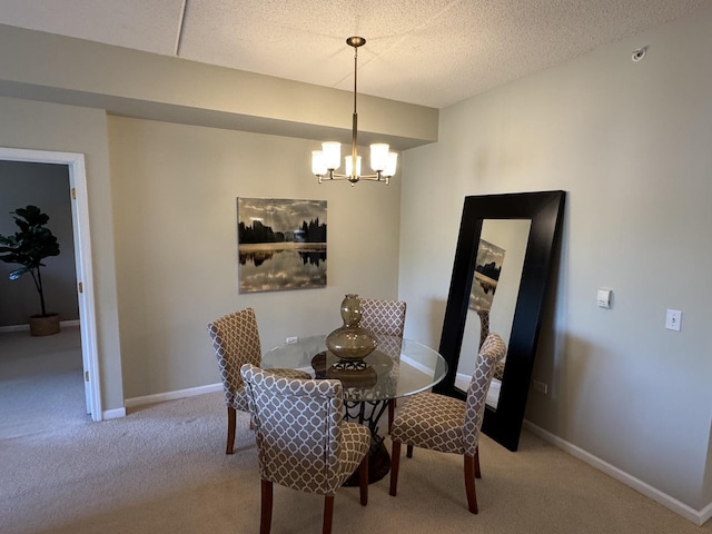 1479 N Milwaukee Ave Unit 312, Libertyville, IL 60048 - dining space with a chandelier, carpet flooring, and a textured ceiling
