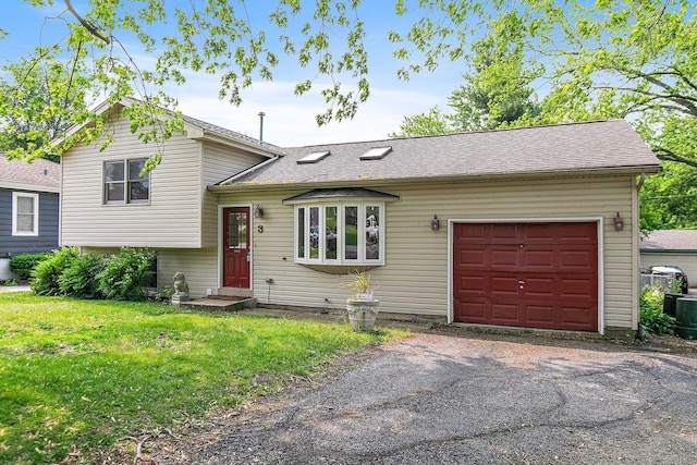 3 Clark Ave, Lake In The Hills, IL 60156 - tri-level home featuring an attached garage, driveway, and a front lawn