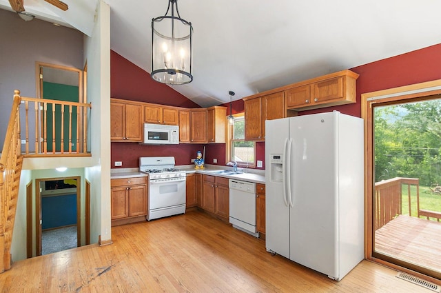 3 Clark Ave, Lake In The Hills, IL 60156 - kitchen with white appliances, light wood-style flooring, light countertops, lofted ceiling, and hanging light fixtures