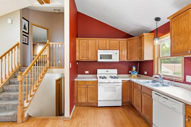 3 Clark Ave, Lake In The Hills, IL 60156 - kitchen featuring white appliances, light wood finished floors, light countertops, hanging light fixtures, and high vaulted ceiling