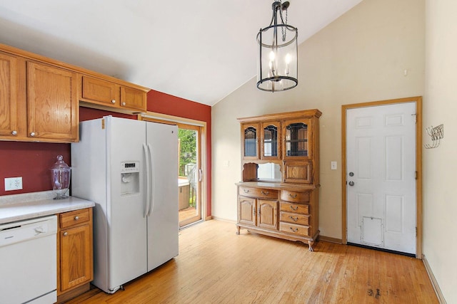 3 Clark Ave, Lake In The Hills, IL 60156 - kitchen featuring white appliances, light wood-style floors, brown cabinets, light countertops, and high vaulted ceiling