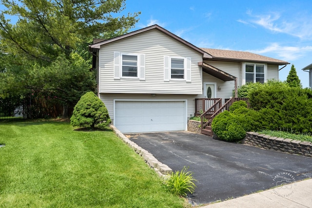 1340 Ironwood Ct, Aurora, IL 60506 - split foyer home featuring an attached garage, asphalt driveway, a front yard, and roof with shingles