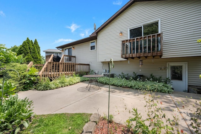 1340 Ironwood Ct, Aurora, IL 60506 - back of house featuring a patio and a wooden deck