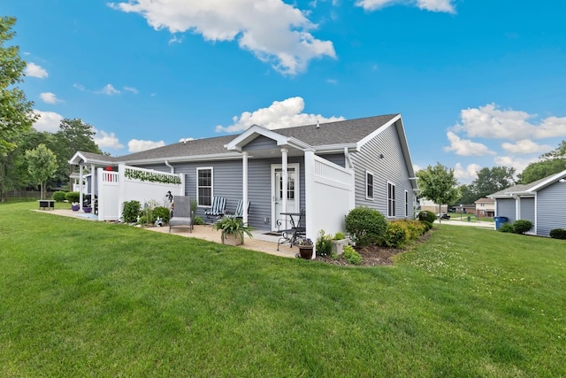 1523 Eadens Pl Unit 1523, Dixon, IL 61021 - rear view of house with a patio area, a yard, and a shingled roof