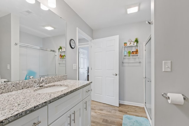 1523 Eadens Pl Unit 1523, Dixon, IL 61021 - full bathroom featuring a shower stall, wood finished floors, and vanity