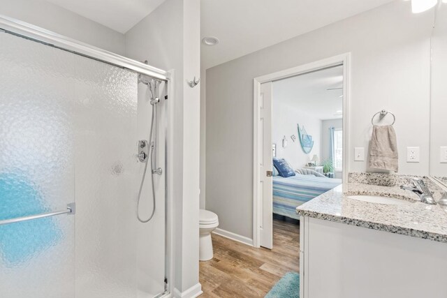 1523 Eadens Pl Unit 1523, Dixon, IL 61021 - bathroom featuring a shower stall, wood finished floors, connected bathroom, and vanity