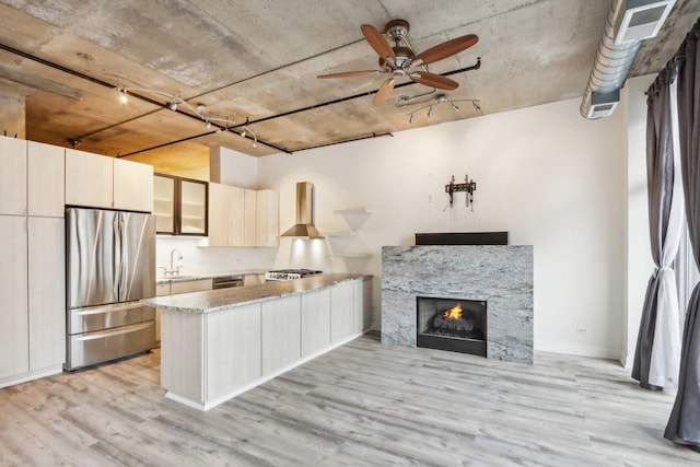 1000 W Adams St Unit 523, Chicago, IL 60607 - kitchen with stainless steel appliances, a peninsula, light wood-type flooring, glass insert cabinets, and a ceiling fan