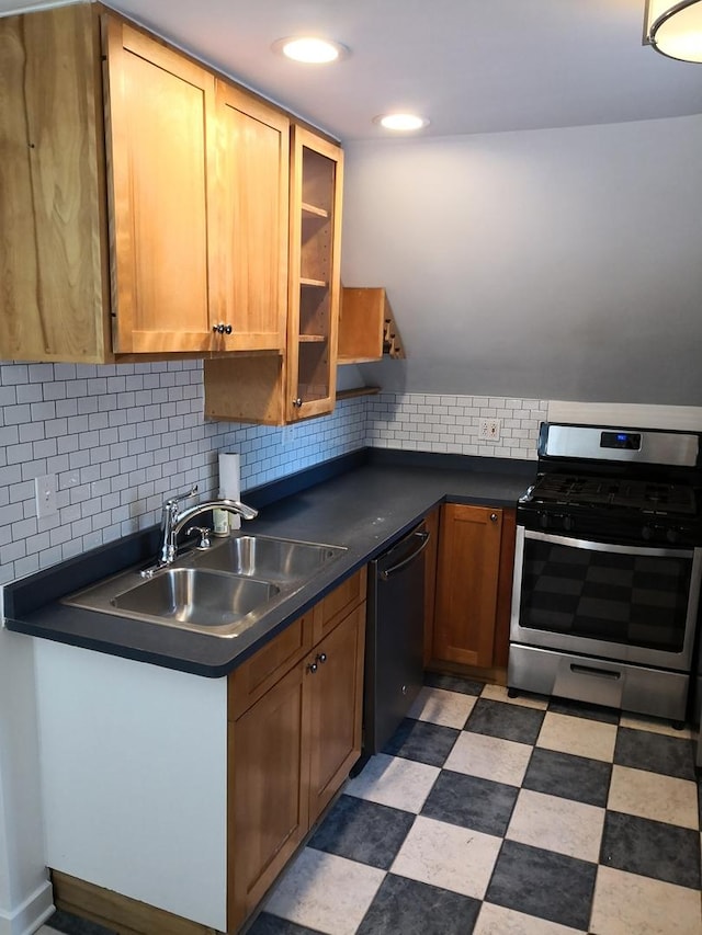 853 N Hoyne Ave, Chicago, IL 60622 - kitchen featuring stainless steel range with gas stovetop, dishwashing machine, dark countertops, and backsplash