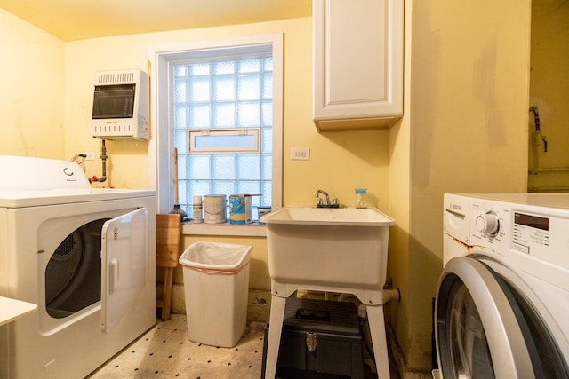 853 N Hoyne Ave, Chicago, IL 60622 - washroom with washing machine and dryer, heating unit, light flooring, and cabinet space