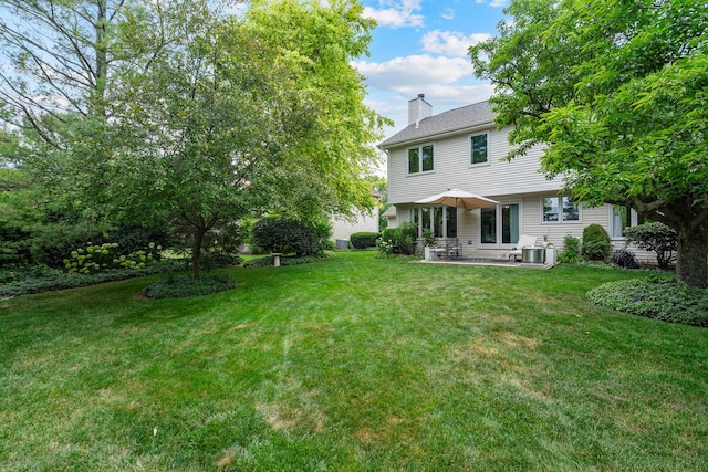 856 Fieldcrest Dr, Bolingbrook, IL 60490 - view of green lawn featuring a patio area