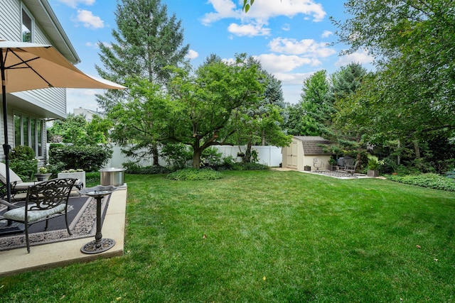 856 Fieldcrest Dr, Bolingbrook, IL 60490 - fenced backyard featuring a storage unit and a patio area
