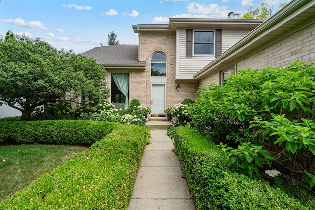 856 Fieldcrest Dr, Bolingbrook, IL 60490 - view of front facade featuring brick siding and roof with shingles