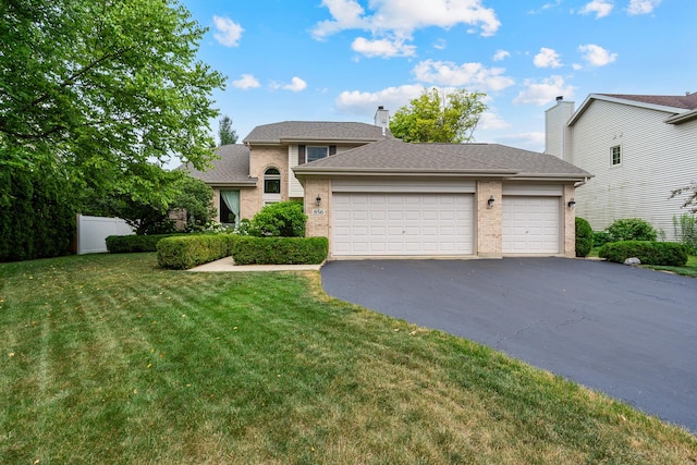 856 Fieldcrest Dr, Bolingbrook, IL 60490 - traditional home featuring brick siding, a front yard, asphalt driveway, and an attached garage