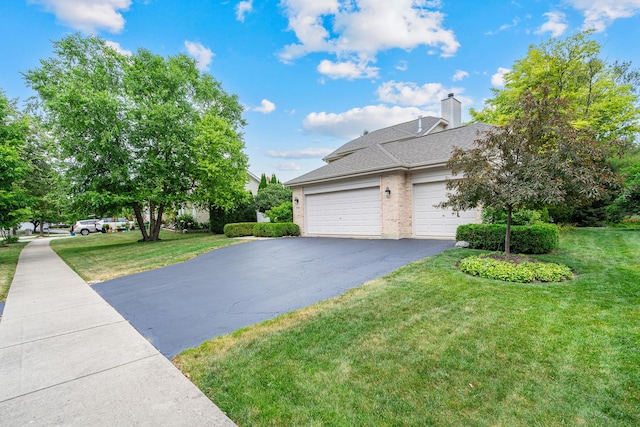 856 Fieldcrest Dr, Bolingbrook, IL 60490 - view of property exterior featuring an attached garage, driveway, a yard, and brick siding