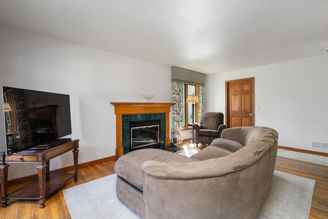856 Fieldcrest Dr, Bolingbrook, IL 60490 - living area featuring a tile fireplace and wood finished floors