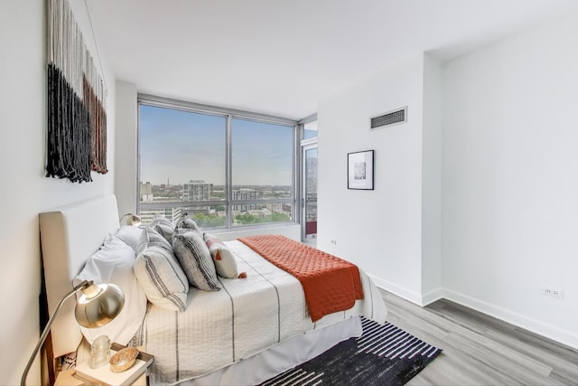 1841 S Calumet Ave Unit 1808, Chicago, IL 60616 - bedroom featuring wood finished floors and a view of city