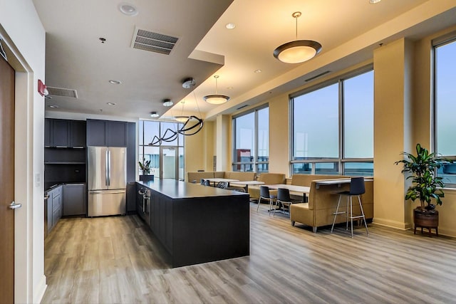 1841 S Calumet Ave Unit 1808, Chicago, IL 60616 - kitchen featuring freestanding refrigerator, light wood-style flooring, a peninsula, pendant lighting, and recessed lighting