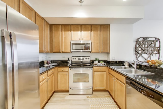 1841 S Calumet Ave Unit 1808, Chicago, IL 60616 - kitchen with appliances with stainless steel finishes, light wood-type flooring, and dark stone counters