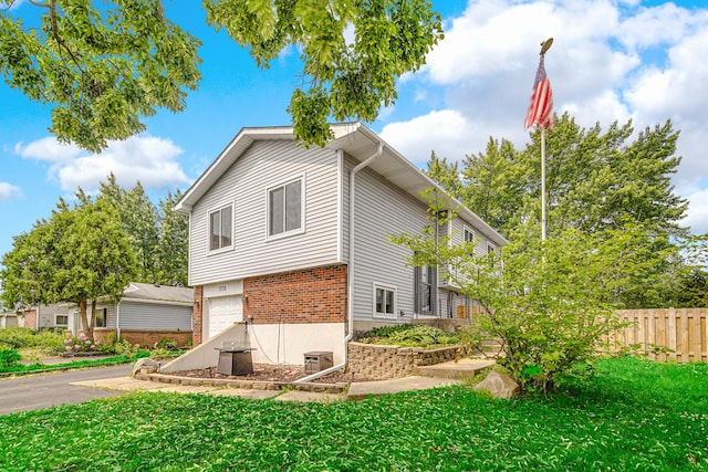570 Sundance Ct, Carol Stream, IL 60188 - view of side of home with an attached garage and brick siding