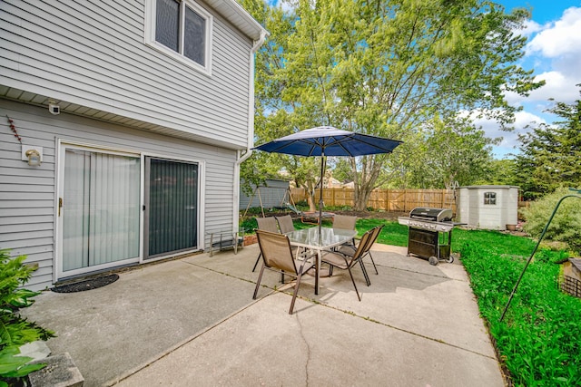 570 Sundance Ct, Carol Stream, IL 60188 - view of patio with a shed, area for grilling, and outdoor dining space
