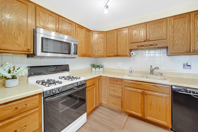 570 Sundance Ct, Carol Stream, IL 60188 - kitchen featuring stainless steel microwave, black dishwasher, white gas stove, and tasteful backsplash