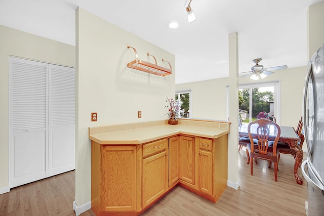 570 Sundance Ct, Carol Stream, IL 60188 - kitchen featuring light wood finished floors, ceiling fan, light countertops, and freestanding refrigerator
