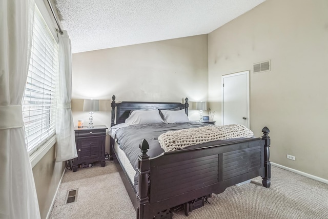 1316 Fireside Ct, Naperville, IL 60564 - bedroom with multiple windows, light carpet, lofted ceiling, and a textured ceiling