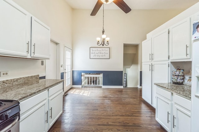 1316 Fireside Ct, Naperville, IL 60564 - kitchen with stainless steel range with electric cooktop, ceiling fan, white cabinetry, dark wood finished floors, and light stone countertops
