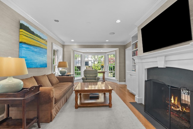 545 Sheridan Rd, Winnetka, IL 60093 - living room featuring a fireplace with flush hearth, wood finished floors, recessed lighting, ornamental molding, and built in shelves