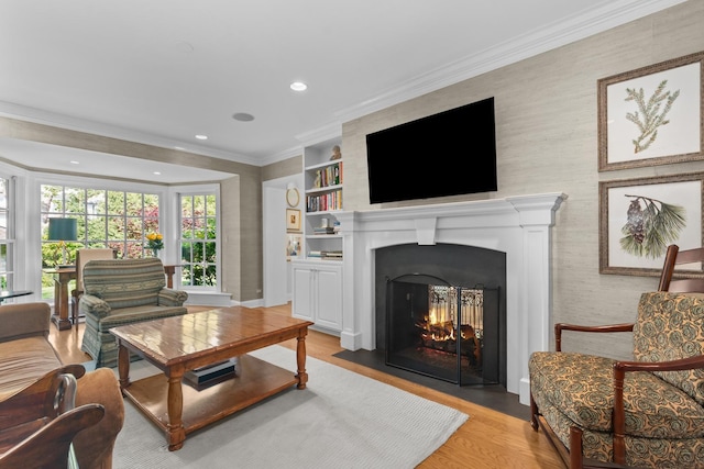 545 Sheridan Rd, Winnetka, IL 60093 - living room featuring a fireplace with flush hearth, light wood-style flooring, recessed lighting, ornamental molding, and built in shelves