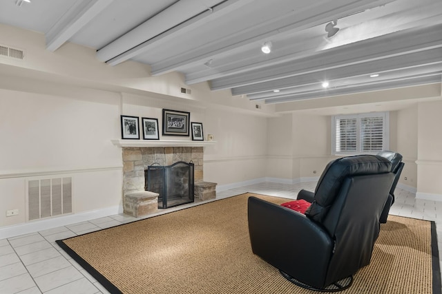 545 Sheridan Rd, Winnetka, IL 60093 - tiled living area with a fireplace and beamed ceiling