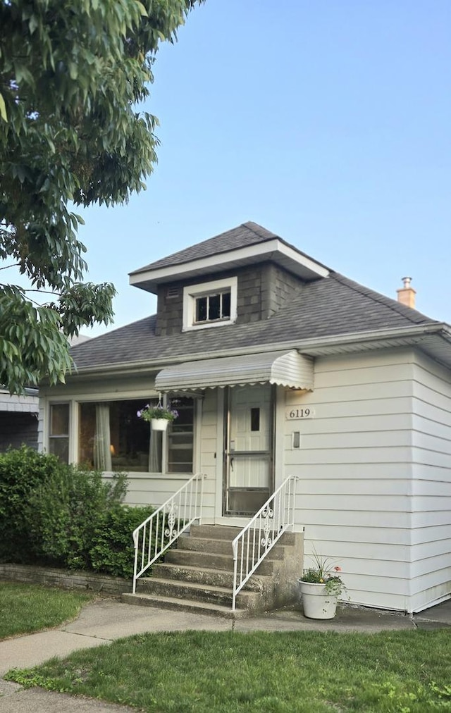 6119 W School St, Chicago, IL 60634 - bungalow featuring a shingled roof and entry steps