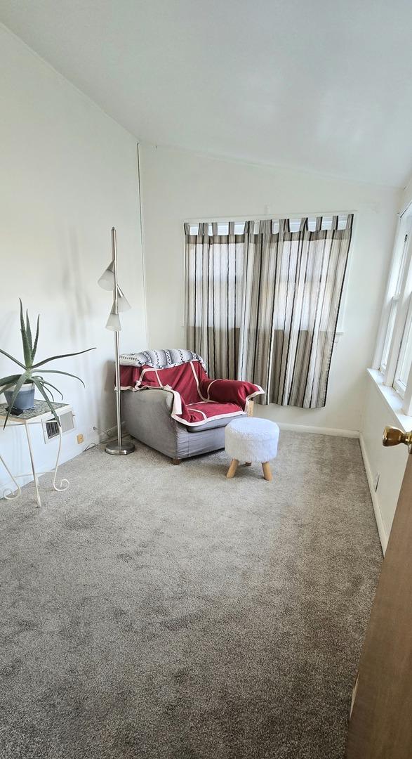 6119 W School St, Chicago, IL 60634 - living area with carpet flooring