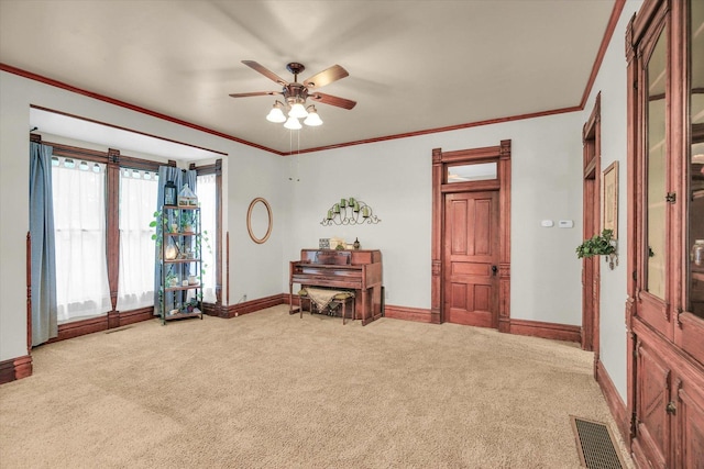 201 W Yates, Newman, IL 61942 - sitting room with carpet floors, ceiling fan, and ornamental molding