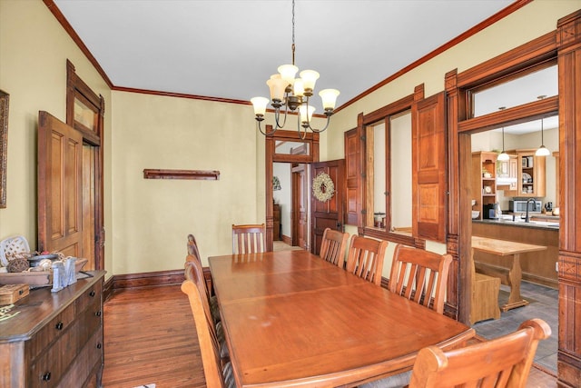 201 W Yates, Newman, IL 61942 - dining room featuring ornamental molding, a chandelier, and wood finished floors