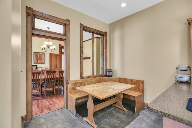 201 W Yates, Newman, IL 61942 - tiled dining room featuring a chandelier and recessed lighting