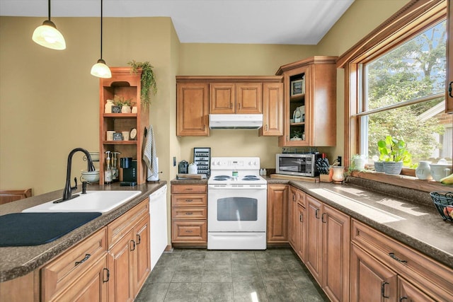 201 W Yates, Newman, IL 61942 - kitchen with white appliances, under cabinet range hood, a peninsula, and dark countertops
