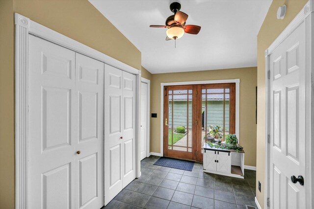 201 W Yates, Newman, IL 61942 - foyer with french doors, dark tile patterned floors, and ceiling fan