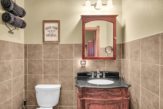 201 W Yates, Newman, IL 61942 - bathroom featuring tile walls, vanity, and wainscoting