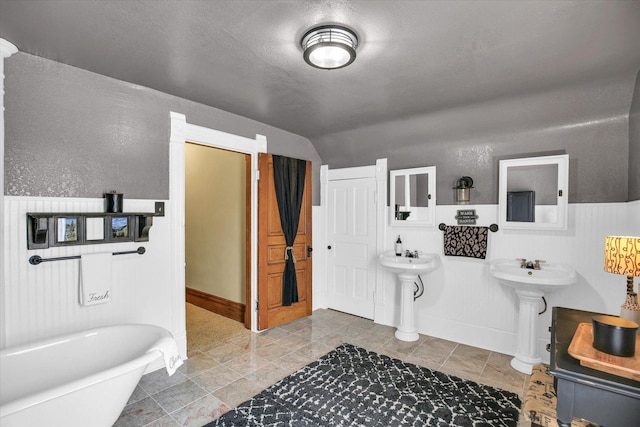 201 W Yates, Newman, IL 61942 - bathroom with a freestanding tub and lofted ceiling