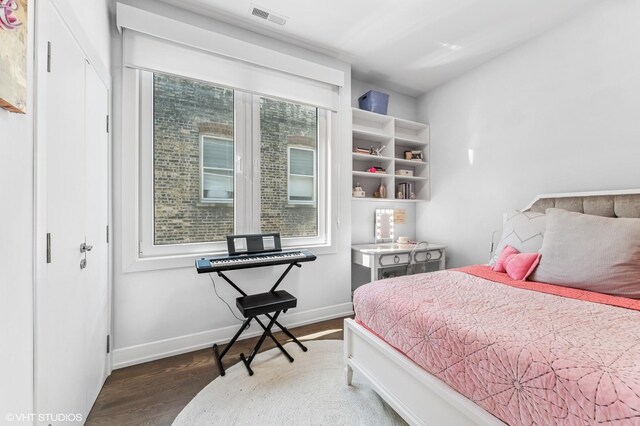 2138 N Sawyer Ave Unit 2, Chicago, IL 60647 - bedroom featuring wood finished floors and baseboards