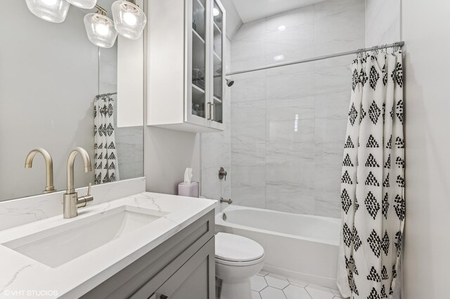 2138 N Sawyer Ave Unit 2, Chicago, IL 60647 - bathroom featuring vanity, shower / bath combo with shower curtain, and tile patterned floors