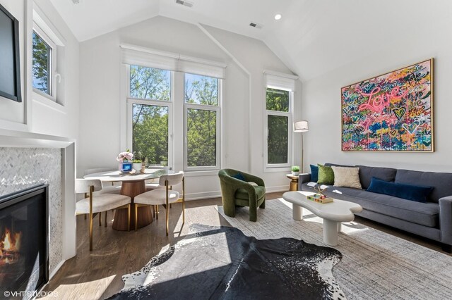 2138 N Sawyer Ave Unit 2, Chicago, IL 60647 - living area with wood finished floors, lofted ceiling, and a fireplace