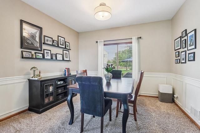 1995 Ridgemore Dr, Bartlett, IL 60103 - dining area with carpet flooring, wainscoting, and a decorative wall