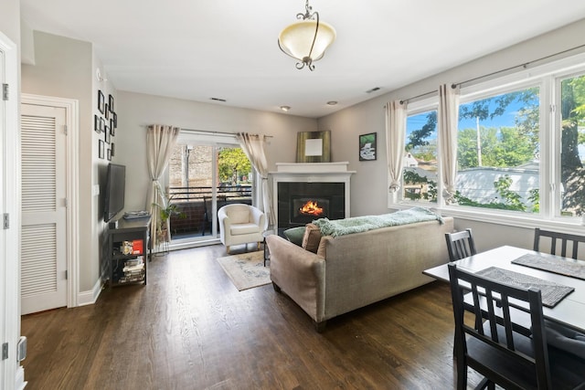 2656 N Hamlin Ave Unit 1W, Chicago, IL 60647 - living area featuring a tile fireplace and dark wood finished floors