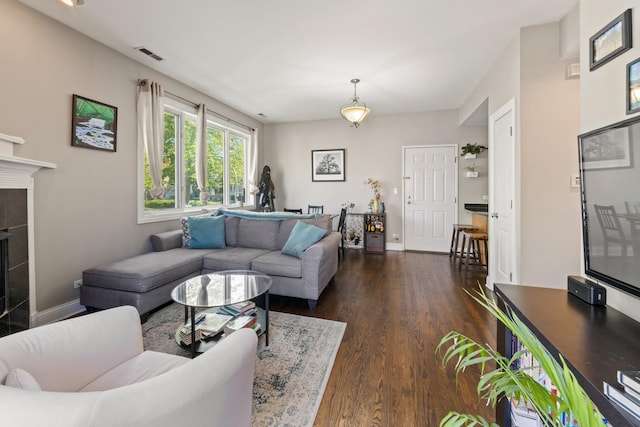 2656 N Hamlin Ave Unit 1W, Chicago, IL 60647 - living room featuring dark wood-style flooring and a tile fireplace