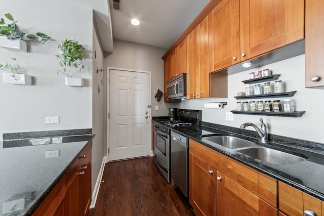 2656 N Hamlin Ave Unit 1W, Chicago, IL 60647 - kitchen with stainless steel appliances, dark wood finished floors, brown cabinetry, dark stone counters, and open shelves